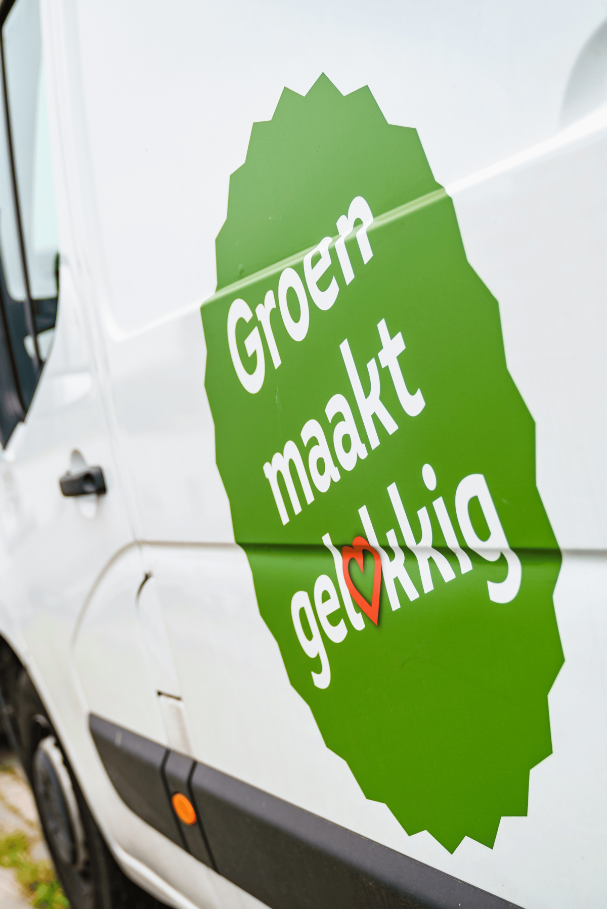 Logo Groen maakt Gelukkig op bus